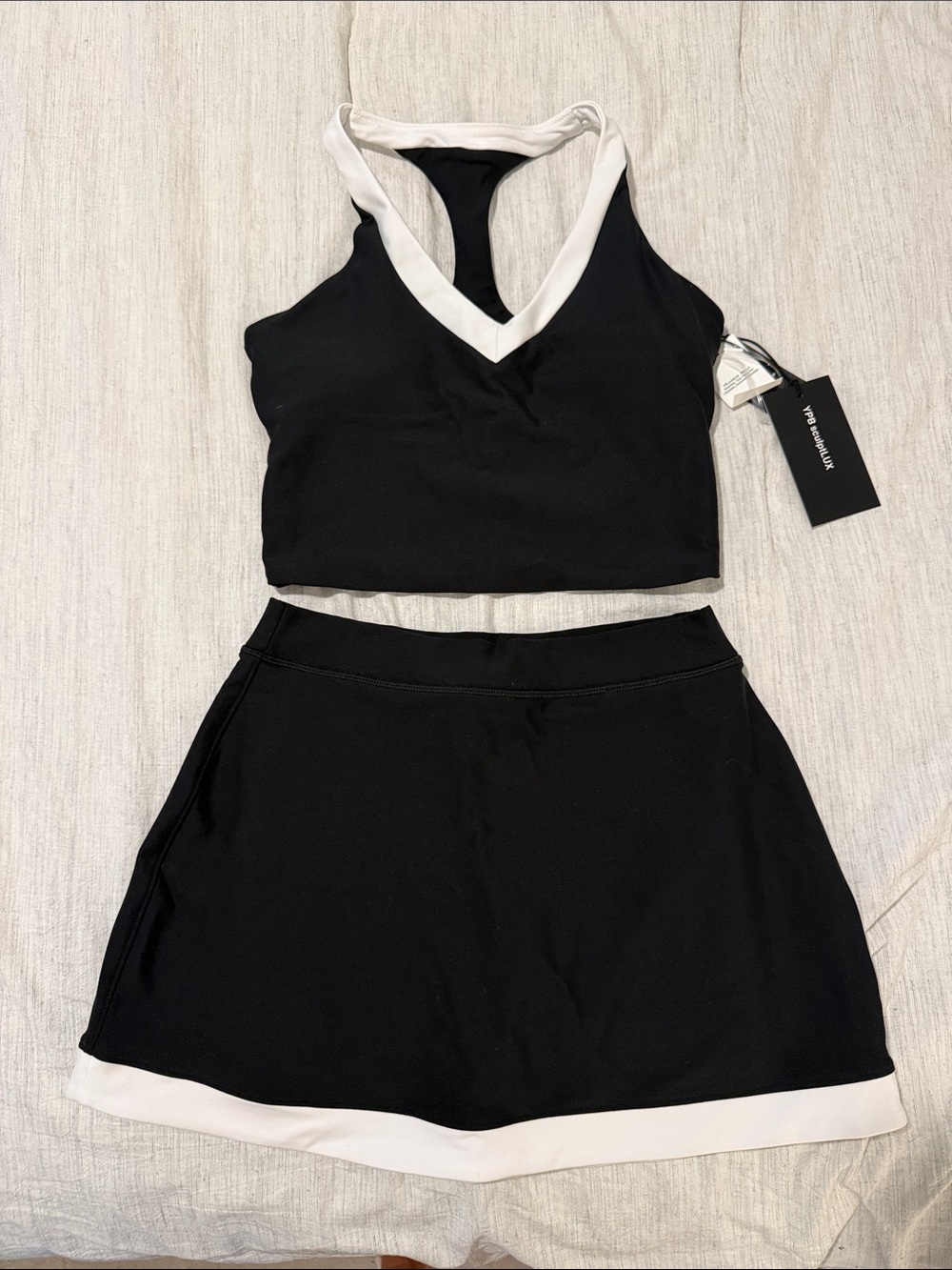 BRAND NEW! WITH TAGS! YPB SCULPTLUX TENNIS SKIRT AND TOP SET. TOP: S/SKIRT:XS.